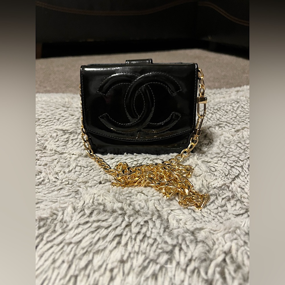 Black leather Chanel compact wallet on a chain authentic